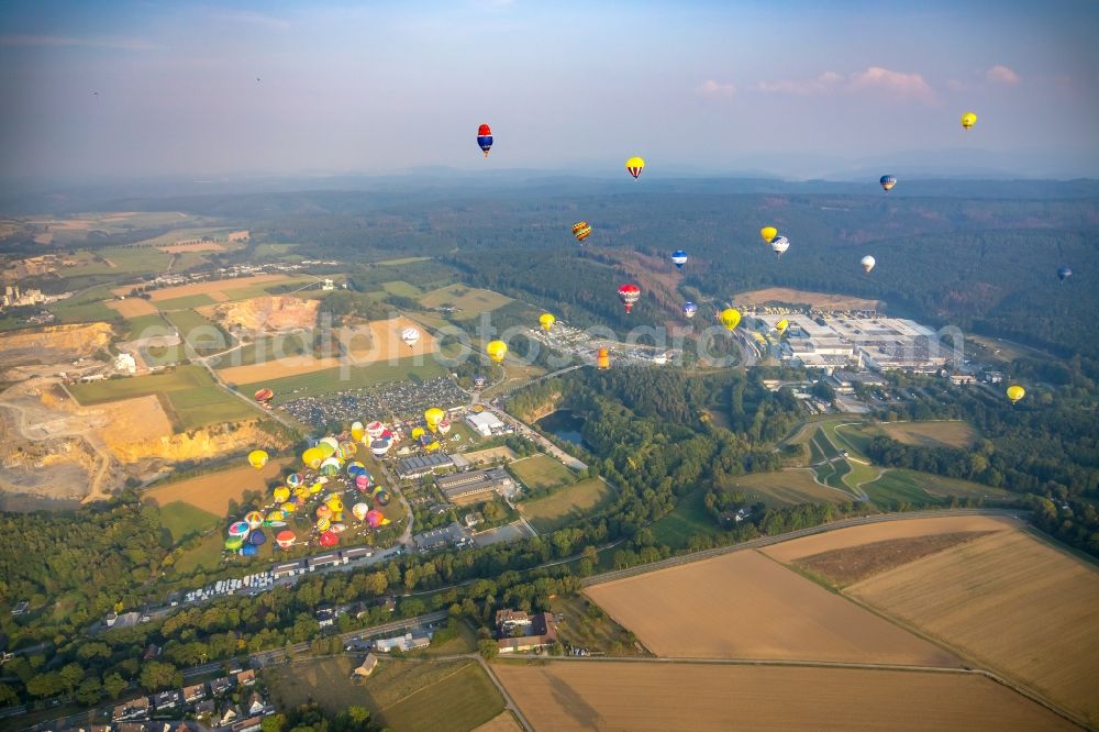 Aerial image Warstein - Hot air balloon Warsteiner Montgolfiade flying over the airspace in Warstein in the state North Rhine-Westphalia, Germany