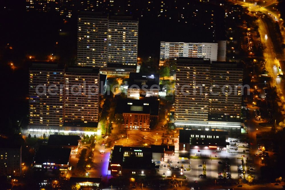 Berlin from the bird's eye view: Night image with a view over the Helende- Weigel- Platz and the district office in Marzahn in Berlin. You can see also some residential buildings and the drugstore Rossmann