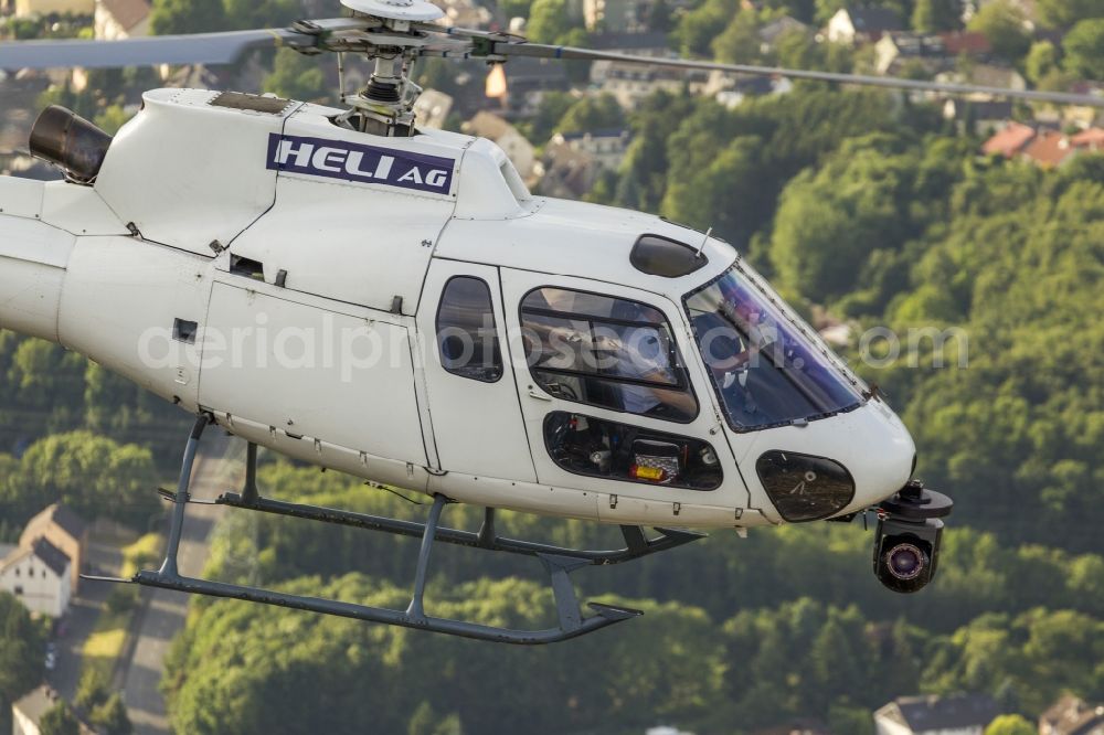 Aerial photograph Witten - Helicopter HELI AG with the registration D-HAUP when shooting in flight over Witten in the state of North Rhine-Westphalia