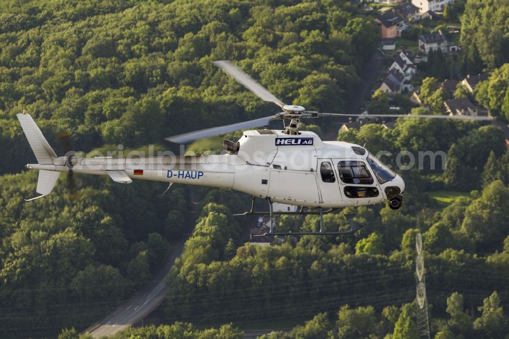 Witten from above - Helicopter HELI AG with the registration D-HAUP when shooting in flight over Witten in the state of North Rhine-Westphalia