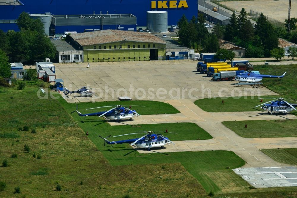 Aerial image Bukarest - Helicopter Mi-8 of the Inspectoratul General de Aviatie on Baneasa Airport in Bucharest, Romania