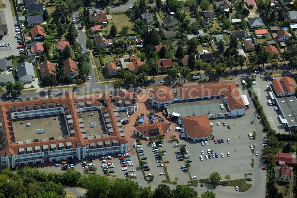 Hoppegarten from above - HEP Hoenow shopping mall in the West of Hoppegarten in the state of Brandenburg. The shopping mall consists of a building complex and parking lot amidst a residential area on Mahsdorfer Strasse