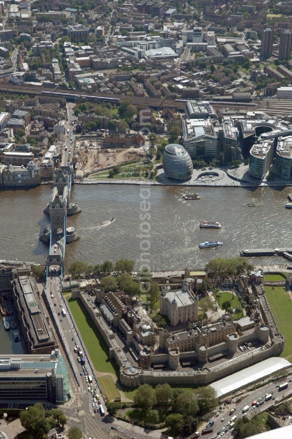 London from the bird's eye view: View of the Tower of London, UNESCO World Heritage Site. The medieval fortress served as a castle, an armory, a royal palace and a prison. Today in the Tower, the British Crown Jewels are kept and an extensive historical collection of weapons is shown