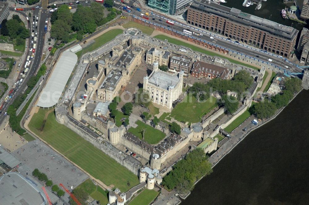 Aerial image London - View of the Tower of London, UNESCO World Heritage Site. The medieval fortress served as a castle, an armory, a royal palace and a prison. Today in the Tower, the British Crown Jewels are kept and an extensive historical collection of weapons is shown