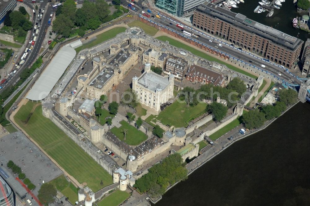 Aerial photograph London - View of the Tower of London, UNESCO World Heritage Site. The medieval fortress served as a castle, an armory, a royal palace and a prison. Today in the Tower, the British Crown Jewels are kept and an extensive historical collection of weapons is shown