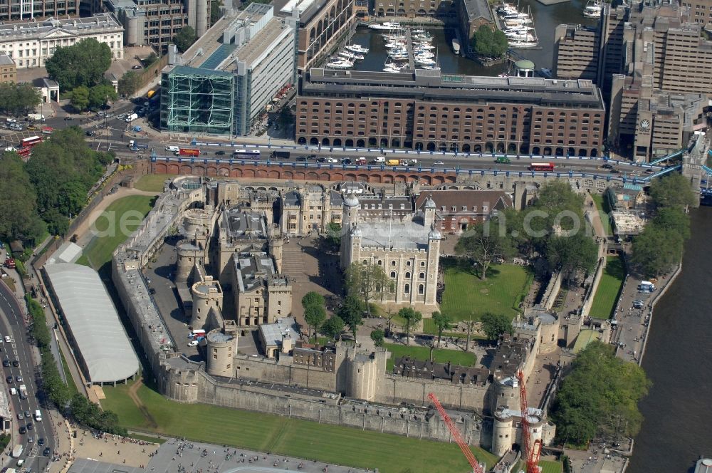 Aerial photograph London - View of the Tower of London, UNESCO World Heritage Site. The medieval fortress served as a castle, an armory, a royal palace and a prison. Today in the Tower, the British Crown Jewels are kept and an extensive historical collection of weapons is shown