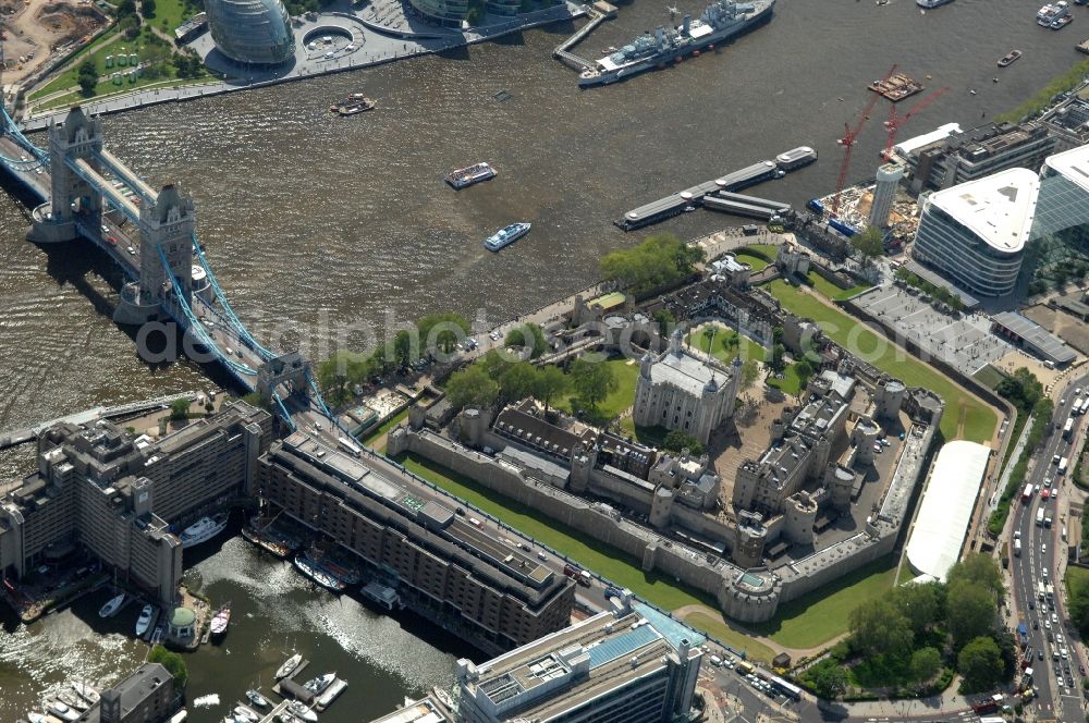 London from above - View of the Tower of London, UNESCO World Heritage Site. The medieval fortress served as a castle, an armory, a royal palace and a prison. Today in the Tower, the British Crown Jewels are kept and an extensive historical collection of weapons is shown