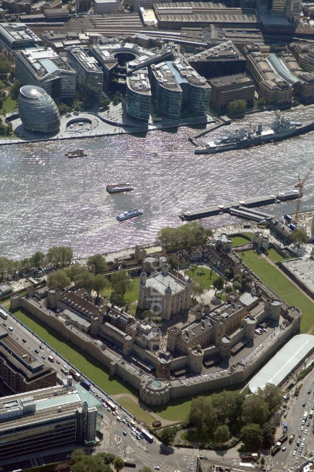 Aerial image London - View of the Tower of London, UNESCO World Heritage Site. The medieval fortress served as a castle, an armory, a royal palace and a prison. Today in the Tower, the British Crown Jewels are kept and an extensive historical collection of weapons is shown