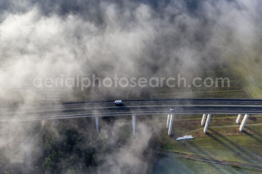 Aerial image Meschede - Autumn - fog weather landscape over the building of the motorway A46 - Viaduct Wennemen in Meschede in the state of North Rhine-Westphalia