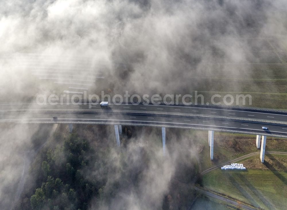 Aerial photograph Meschede - Autumn - fog weather landscape over the building of the motorway A46 - Viaduct Wennemen in Meschede in the state of North Rhine-Westphalia