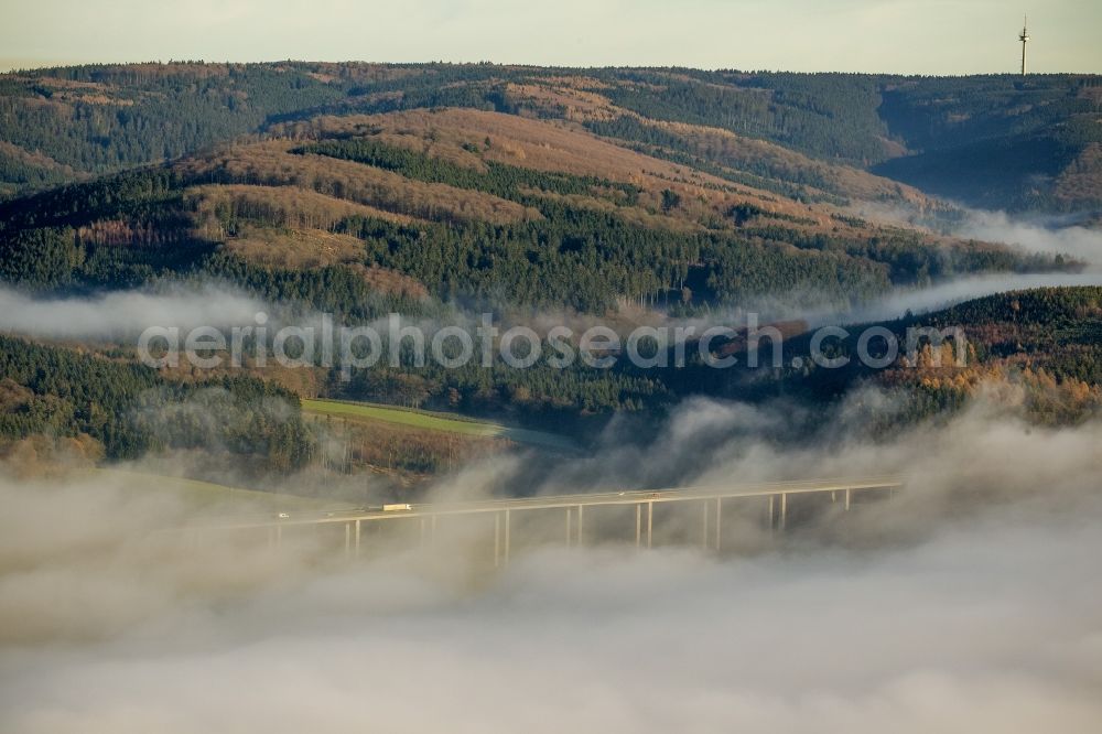 Meschede from above - Autumn - fog weather landscape over the building of the motorway A46 - Viaduct Wennemen in Meschede in the state of North Rhine-Westphalia