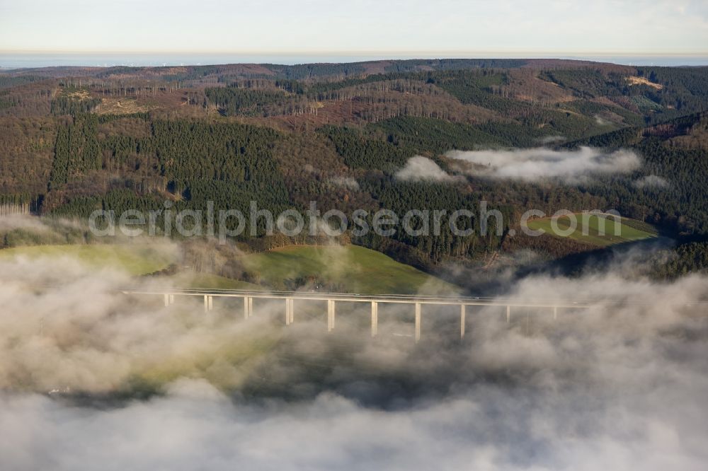 Aerial photograph Meschede - Autumn - fog weather landscape over the building of the motorway A46 - Viaduct Wennemen in Meschede in the state of North Rhine-Westphalia