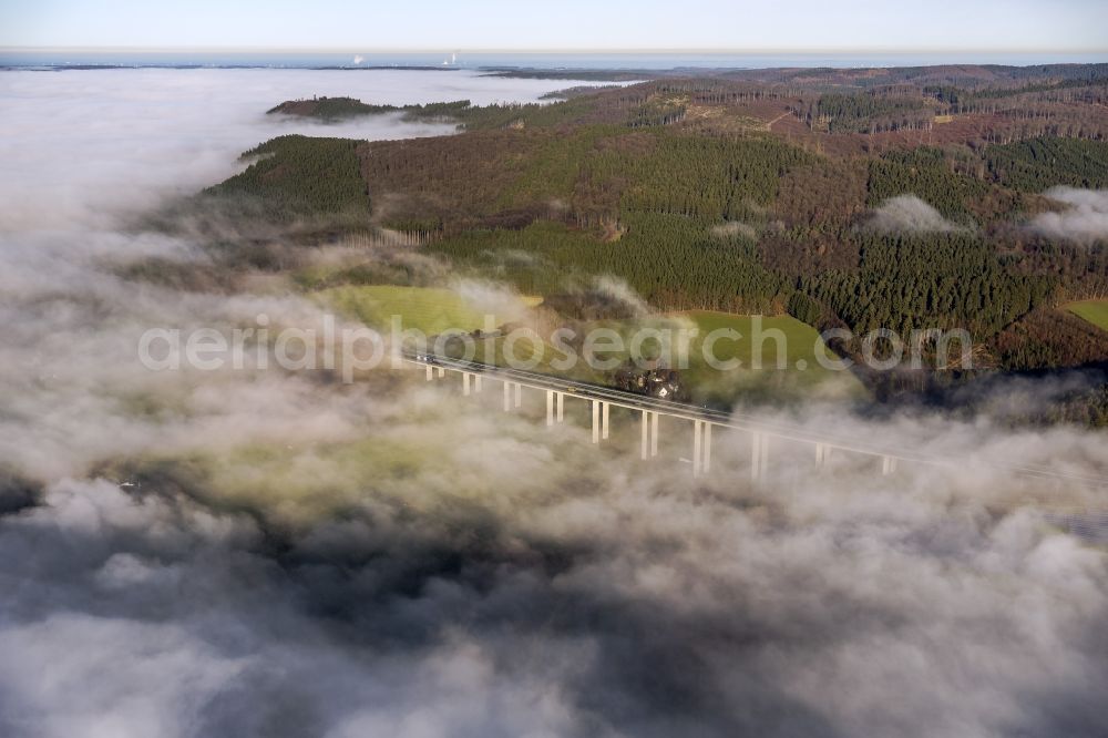 Meschede from above - Autumn - fog weather landscape over the building of the motorway A46 - Viaduct Wennemen in Meschede in the state of North Rhine-Westphalia