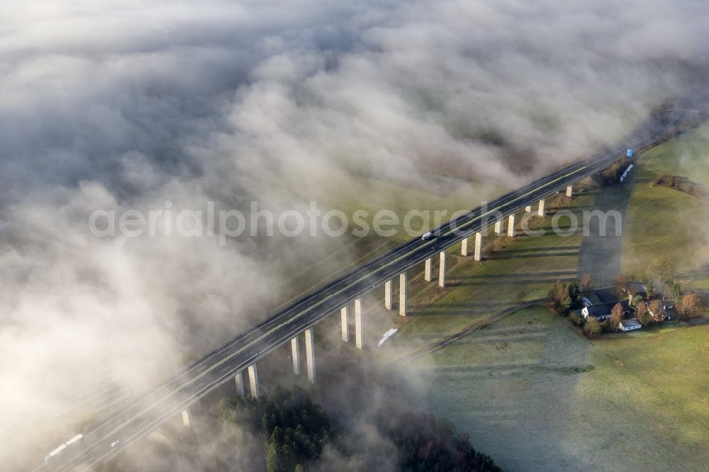 Aerial photograph Meschede - Autumn - fog weather landscape over the building of the motorway A46 - Viaduct Wennemen in Meschede in the state of North Rhine-Westphalia