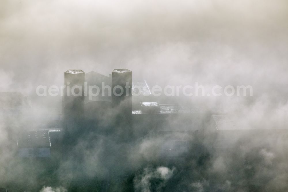 Meschede from the bird's eye view: Autumn - Weather landscape over the space enclosed by clouds and haze Abbey Königsmünster in Meschede in the state of North Rhine-Westphalia