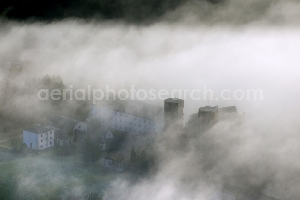 Meschede from above - Autumn - Weather landscape over the space enclosed by clouds and haze Abbey Königsmünster in Meschede in the state of North Rhine-Westphalia