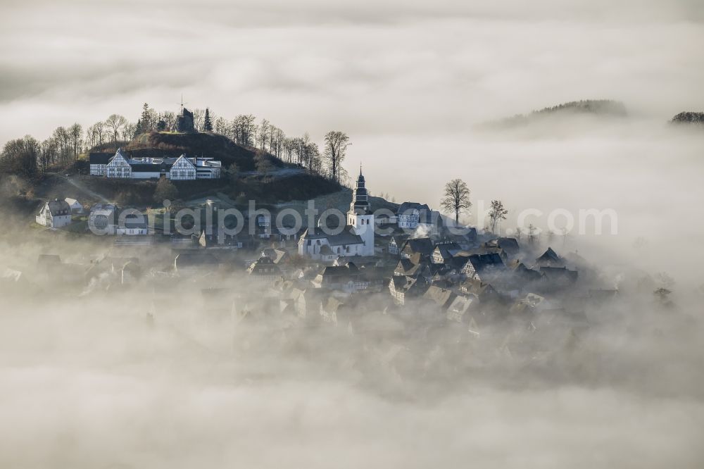 Aerial photograph Meschede OT Bergstadt Eversberg - Autumn - Weather landscape over the space enclosed by clouds and haze district Eversberg in Meschede in the state of North Rhine-Westphalia