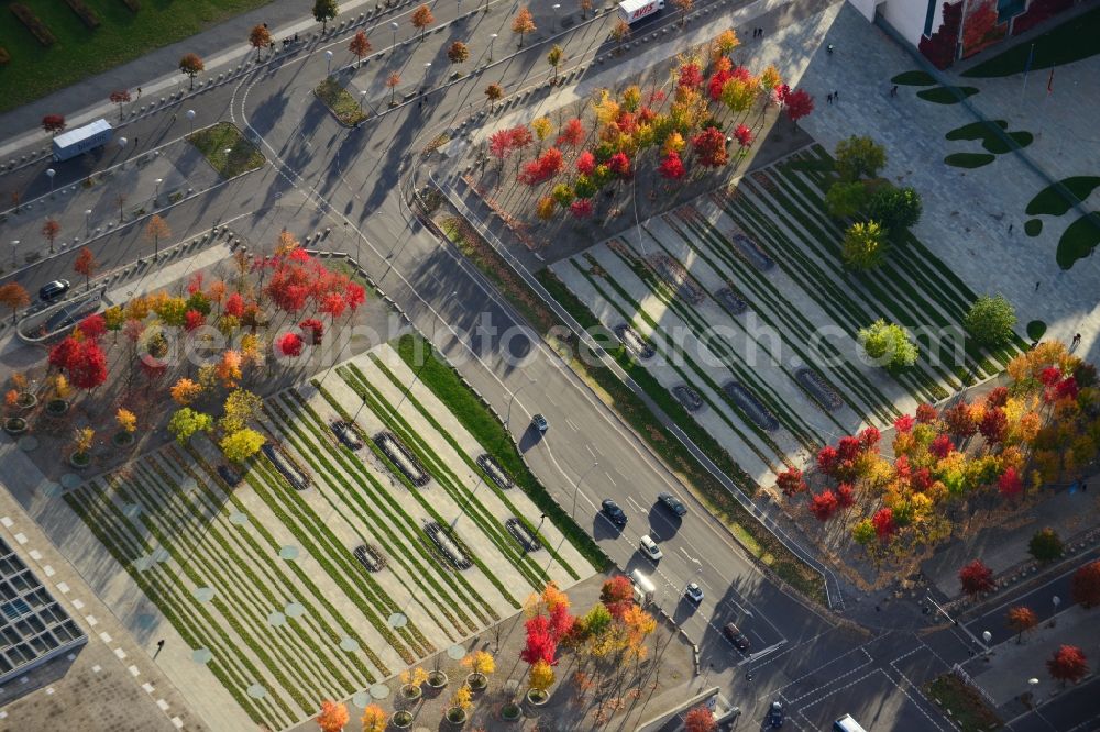 Berlin Mitte from the bird's eye view: Autumn landscape colorful colored rows of trees on the forum at the chancellery in Berlin - Mitte