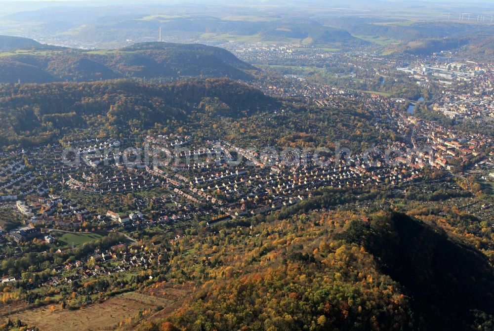 Aerial image Jena - Autumn colored trees on the slopes of the mountains and a view of the core city of Jena in Thuringia