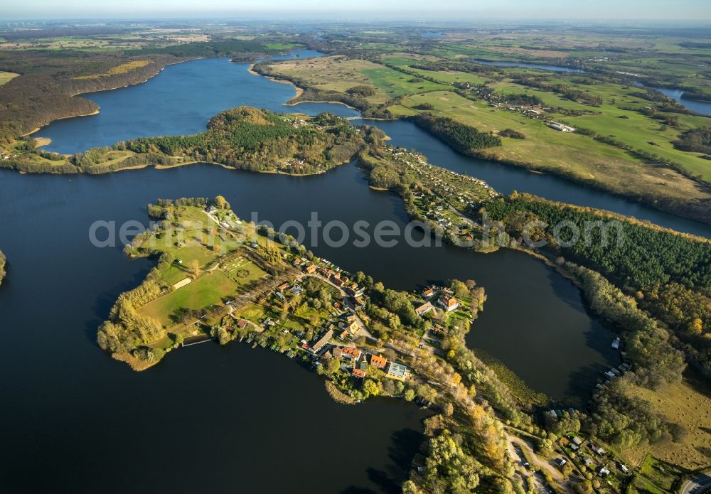 Feldberg from the bird's eye view: Autumnal view at the Feldberg lake landscape near the Feldberg in the federal state of Mecklenburg-Vorpommern. Here to see the Hausee and the city of Feldberg