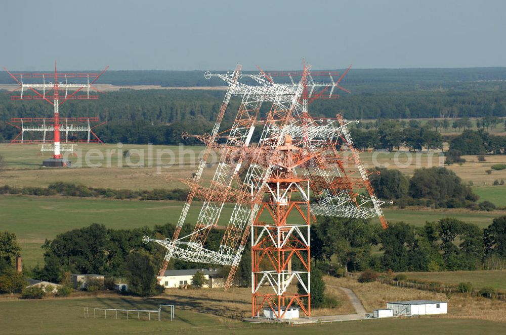 Aerial photograph NAUEN - Herbstlicher Blick auf das Areal der Kurzwellen- Rundfunksendestelle Nauen. Im Mittelpunkt Areales befindet sich das 1920 eingeweihte Muthesius-Gebäude, in dem heute die Leitstelle der vier modernen Kurzwellensender untergebracht ist. Von Nauen aus wird das Programm von DW-RADIO rund um den Globus gesendet.