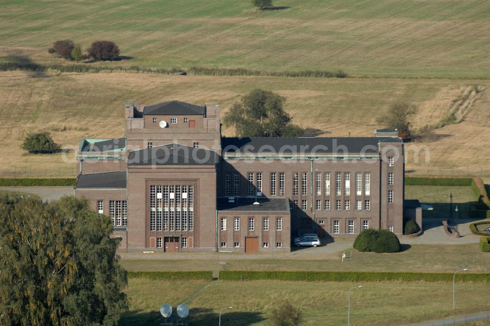 Aerial photograph NAUEN - Herbstlicher Blick auf das Areal der Kurzwellen- Rundfunksendestelle Nauen. Im Mittelpunkt Areales befindet sich das 1920 eingeweihte Muthesius-Gebäude, in dem heute die Leitstelle der vier modernen Kurzwellensender untergebracht ist. Von Nauen aus wird das Programm von DW-RADIO rund um den Globus gesendet.