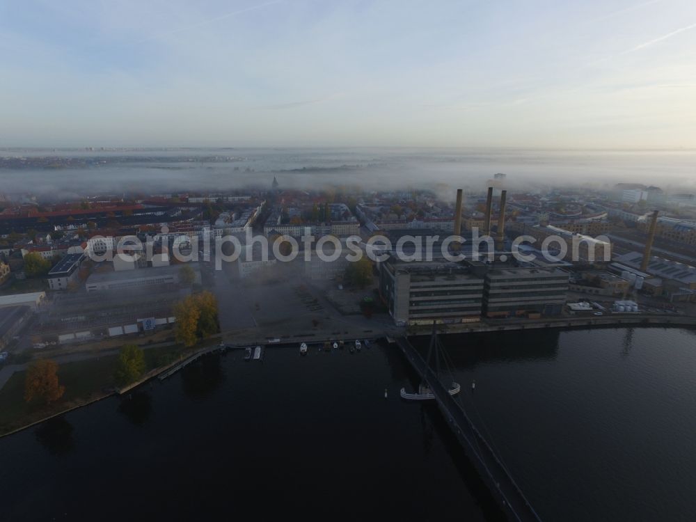 Berlin from above - Autumnal fog layers on the banks of the river course of the River Spree in Berlin Schoeneweide