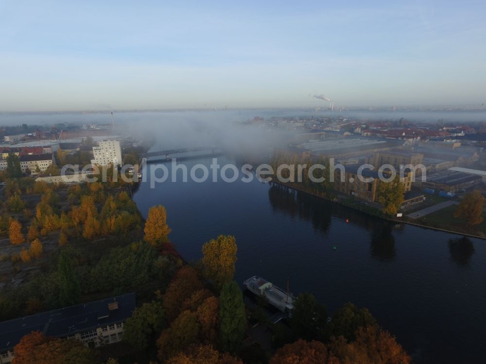 Aerial photograph Berlin - Autumnal fog layers on the banks of the river course of the River Spree in Berlin Schoeneweide