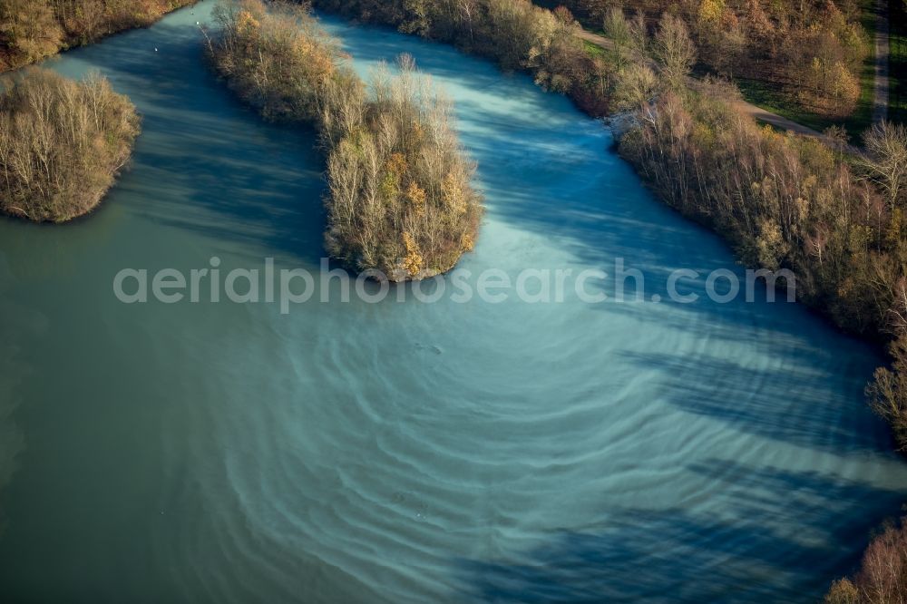 Aerial photograph Bochum - Autumnal Harpener Pond in a forest in the East of Bochum in the state of North Rhine-Westphalia. Small wooded islands are located in the grey bluish water