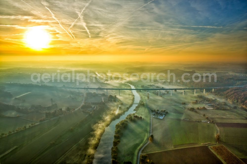 Mülheim an der Ruhr from the bird's eye view: Autumn fog and haze on the route and the lanes of the highway bridge over the motorway A 52 over the river Ruhr in Muelheim an der Ruhr in the state North Rhine-Westphalia