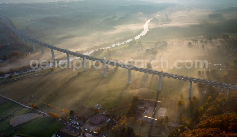 Mülheim an der Ruhr from the bird's eye view: Autumn fog and haze on the route and the lanes of the highway bridge over the motorway A 52 Ruhrtalbruecke in Muelheim an der Ruhr in the state North Rhine-Westphalia