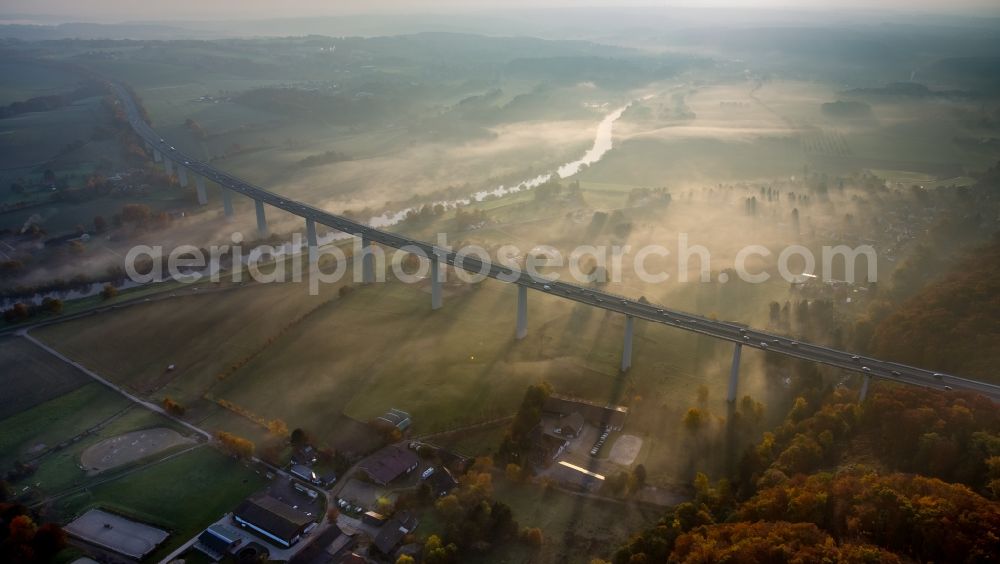 Mülheim an der Ruhr from the bird's eye view: Autumn fog and haze on the route and the lanes of the highway bridge over the motorway A 52 Ruhrtalbruecke in Muelheim an der Ruhr in the state North Rhine-Westphalia