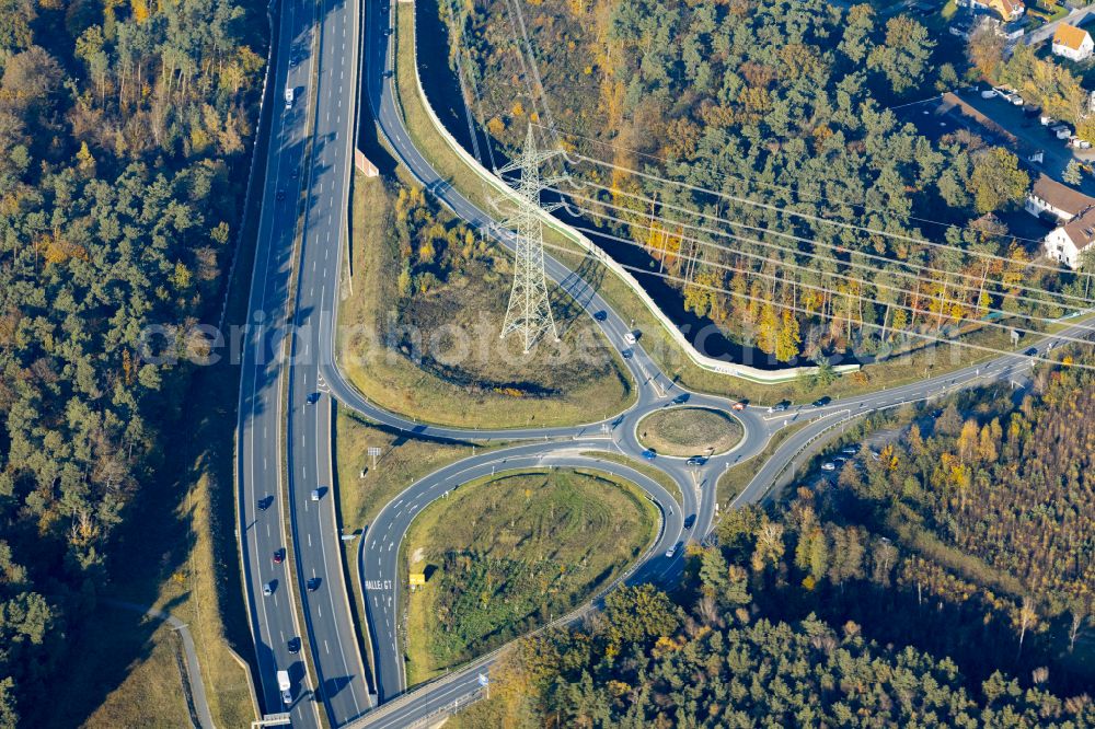 Aerial image Halle (Westfalen) - Autumnal discolored vegetation view route and lanes in the course of the exit and access of the motorway junction of the BAB A33 in Halle (Westfalen) in the state North Rhine-Westphalia, Germany