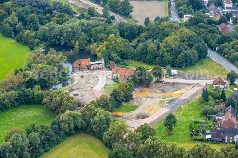 Heessen from above - Autumn discolored vegetation view Residential construction site of a mixed development with multi-family houses and single-family houses- new building at the Castle Mill in Heessen in the Ruhr area in the state of North Rhine-Westphalia, Germany