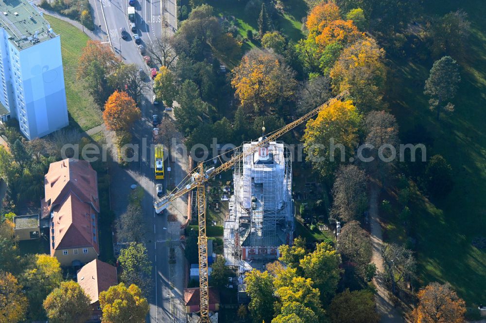 Berlin from above - Autumnal discolored vegetation view construction site for renovation and reconstruction work on the church building of Schlosskirche on street Alt-Buch in the district Buch in Berlin, Germany