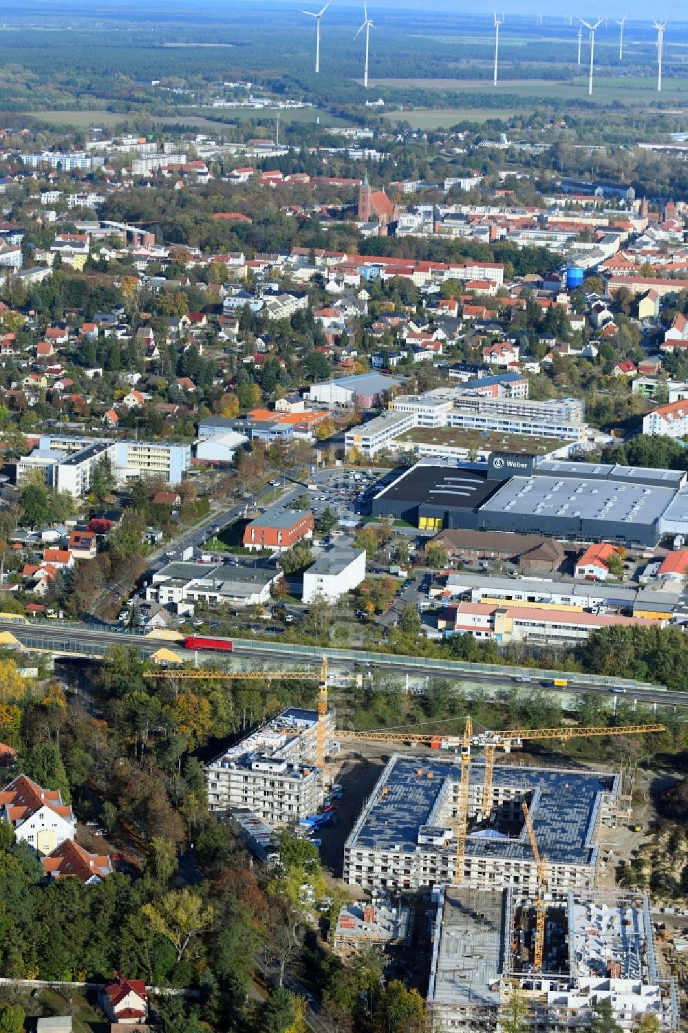 Bernau from the bird's eye view: Autumnal discolored vegetation view construction site to build a new multi-family residential complex Waldquartier Friedenstal-Bernau on Zepernicker Chaussee corner Lenastrasse in Bernau in the state Brandenburg, Germany