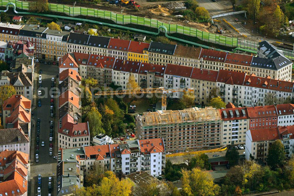 Leipzig from the bird's eye view: Autumnal discolored vegetation view construction site for the multi-family residential building on Wichernstrasse in the district Anger-Crottendorf in Leipzig in the state Saxony, Germany