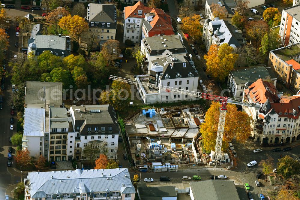 Aerial photograph Leipzig - Autumn colored vegetation view Construction site for the new construction of an apartment building with condominiums on Inselstrasse in the district Zentrum in Leipzig in the state Saxony, Germany