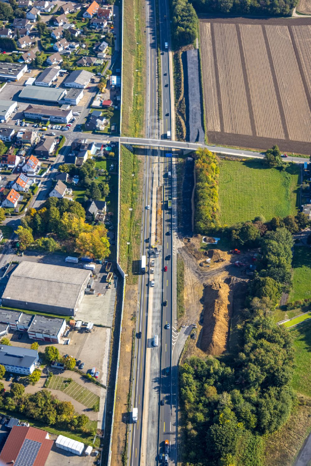 Brackel from the bird's eye view: Autumnal discolored vegetation view construction site for the new building and extension of the road of B1 in Brackel at Ruhrgebiet in the state North Rhine-Westphalia, Germany