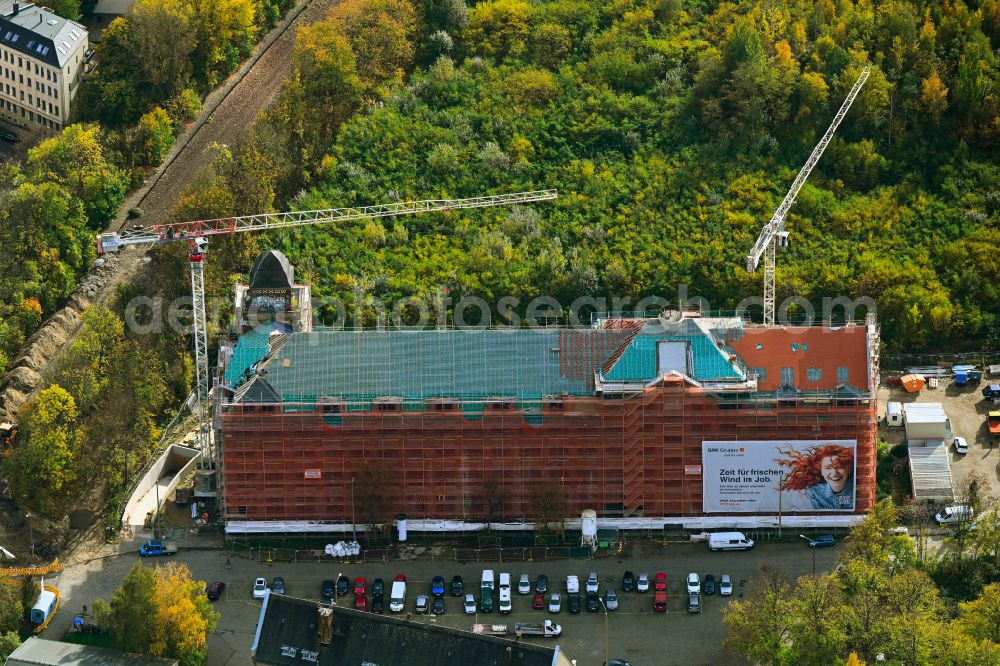 Aerial photograph Leipzig - Autumnal discolored vegetation view Construction site to convert the historic building of the Karl Krause Fabrik to an apartment building on Theodor-Neubauer-Strasse in the district Anger-Crottendorf in Leipzig in the state Saxony, Germany