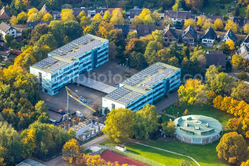 Aerial photograph Bottrop - Autumnal discolored vegetation view new construction site for the extension of the school building Heinrich-Heine-Gymnasium on street Gustav-Ohm-Strasse in Bottrop at Ruhrgebiet in the state North Rhine-Westphalia, Germany