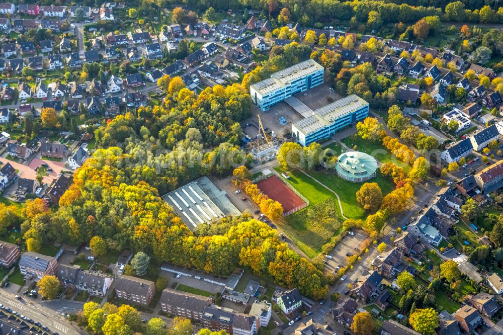 Bottrop from above - Autumnal discolored vegetation view new construction site for the extension of the school building Heinrich-Heine-Gymnasium on street Gustav-Ohm-Strasse in Bottrop at Ruhrgebiet in the state North Rhine-Westphalia, Germany