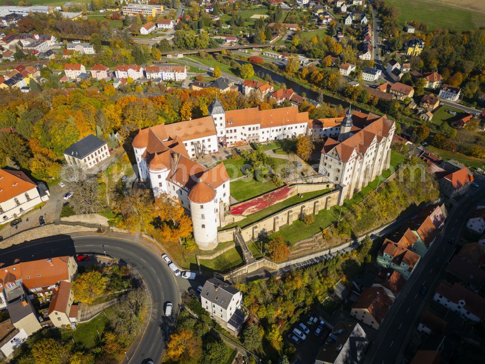 Nossen from the bird's eye view: Autumnal discolored vegetation view castle of Schloss Nossen in Nossen in the state Saxony, Germany