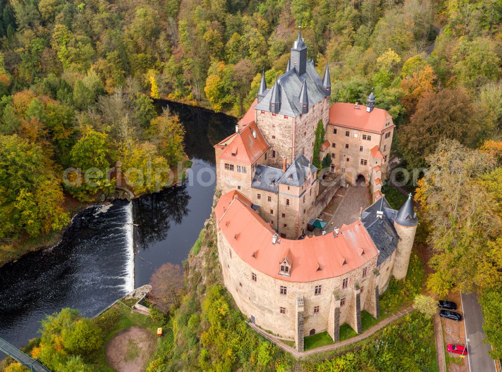 Kriebstein from above - Autumnal discolored vegetation view walls of the castle complex on the plateau on street Kriebsteiner Strasse in Kriebstein in the state Saxony, Germany