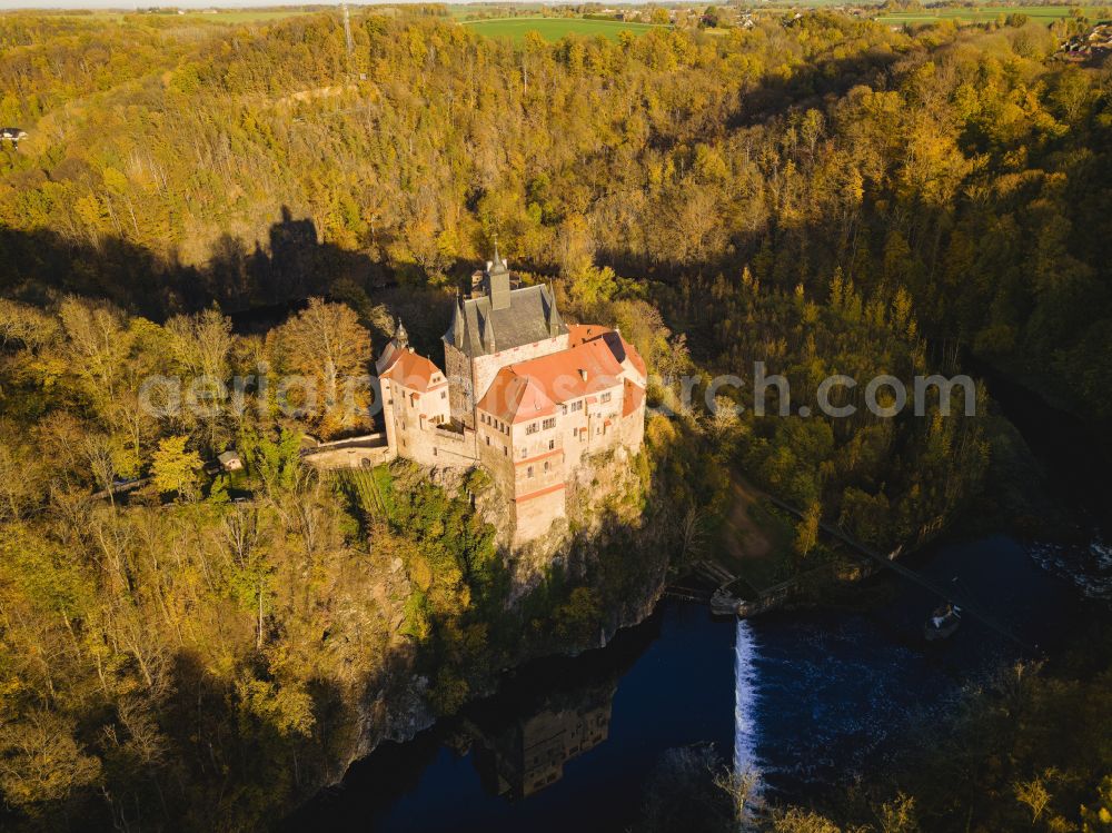 Kriebstein from above - Autumnal discolored vegetation view walls of the castle complex on the plateau on street Kriebsteiner Strasse in Kriebstein in the state Saxony, Germany