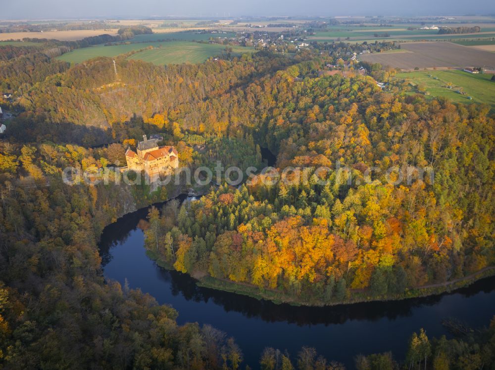 Kriebstein from above - Autumnal discolored vegetation view walls of the castle complex on the plateau on street Kriebsteiner Strasse in Kriebstein in the state Saxony, Germany