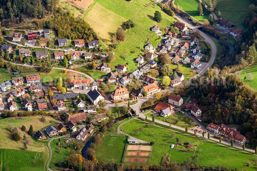 Oberwolfach from above - Autumnal discolored vegetation view village - view on the edge of forested areas in Oberwolfach in the state Baden-Wuerttemberg, Germany