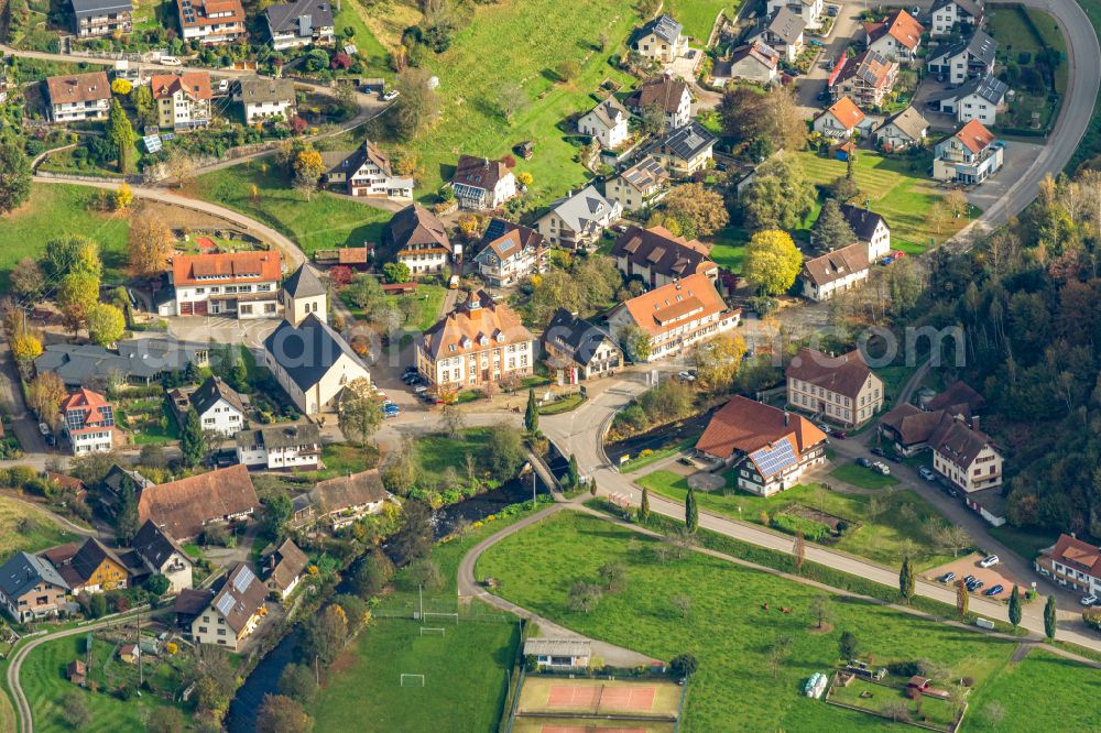 Oberwolfach from above - Autumnal discolored vegetation view village - view on the edge of forested areas in Oberwolfach in the state Baden-Wuerttemberg, Germany