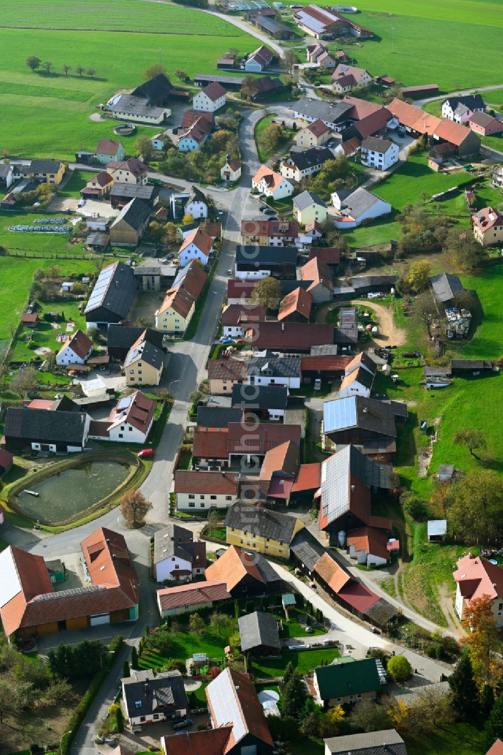 Großenschwand from the bird's eye view: Autumnal discolored vegetation view village view in Grossenschwand in the state Bavaria, Germany