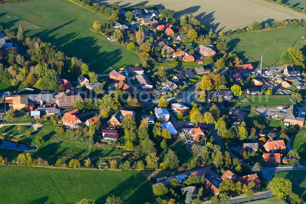 Groß Pampau from above - Autumnal discolored vegetation view agricultural land and field boundaries surround the settlement area of the village in Gross Pampau in the state Schleswig-Holstein, Germany